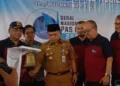 Al Haris Serahhkan E-Pas Kecil Dibawah GT 7 Kepada Pemilik Kapal