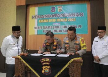 Anwar Sadat Saksikan Penandatanganan  NPHD Antara Polres dan Sat Pol-PP Tanjabbar